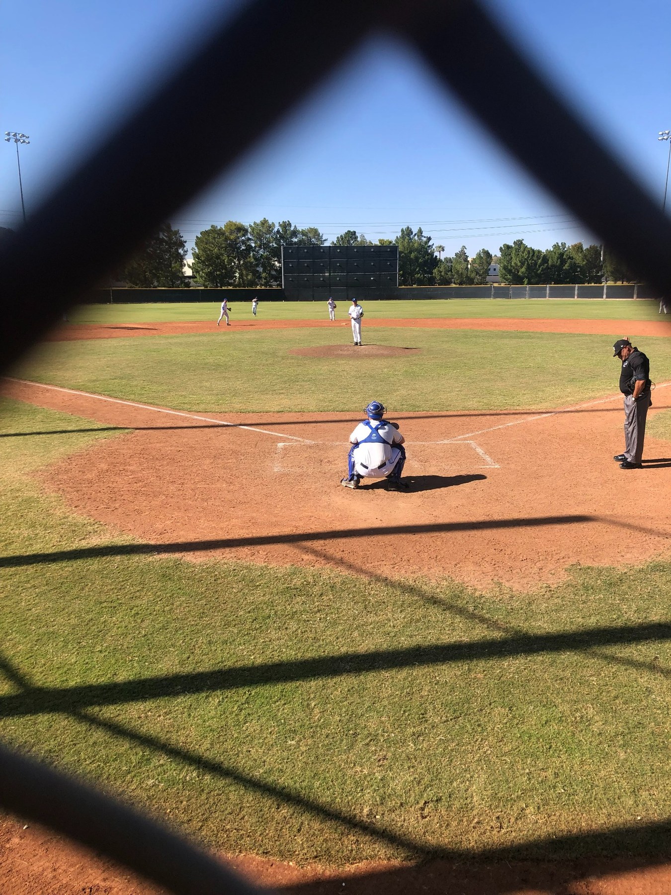 Steve Pignotti catching behind home plate on a baseball field